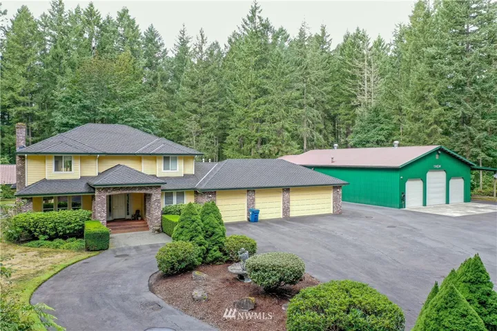 As you enter this 5 Acre property through the brick entrance monument you can see the 3350 SF home with the 4 car attached garage and the over 4000 SF detached garage that can hold up to 16 cars. There is also a 1200 SF picnic area in the rear and a 1400 SF carport with a 50 Amp plug-in.