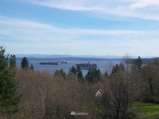 Photo taken from the neighbors deck at the top of the property.  A home built on the upper part of listed property would have a very similar view.