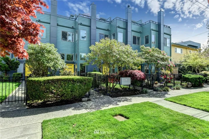 Alki Townhomes.  5 unit enclave set back off quiet street with mature landscaping and private front yards.  New Hardi-Plank siding, New double pane low-e glass windows, New front doors and Custom Glass awnings all completed in 2018!