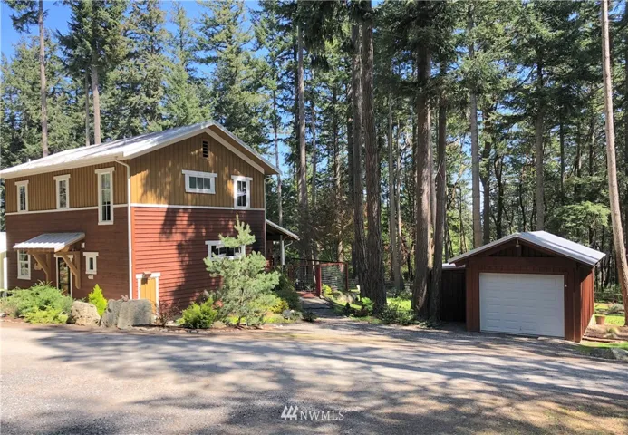Charming Craftsman style home with single car garage. There are 2 "bonus" storage spaces attached to the garage. The house sits on a little over 1/2 acre of land with lovely gardens and trees. Fenced back patio and garden.