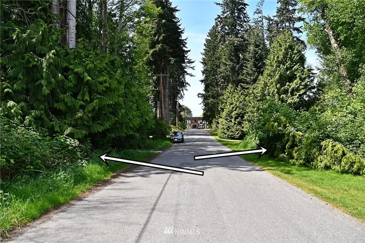 These 2 parcels are along Edgecliff Drive.  In the distance is the former Langley Middle school, now used as the South Whidbey Community Center.