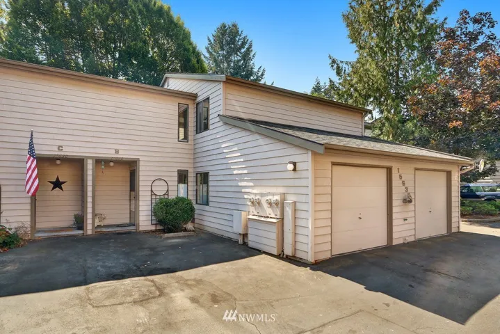 View of front w/ large single garage.  Also includes a work bench & room for more storage!