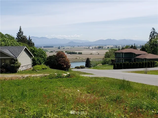 Lot looking East over the Channel and the Tulip Fields.  and the Cascade Mountain Range.