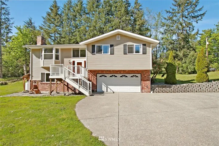 You will enjoy greeting your guests on this large front deck, maintenance free quality with vinyl (pvc) flooring and aluminum handrails. Beautiful Home with Red brick and easy care vinyl siding! You have got to see the inside of this amazing home! Enjoy quiet and peaceful setting, living in the country, yet minutes to lakes and golf, beach and fun things to do.