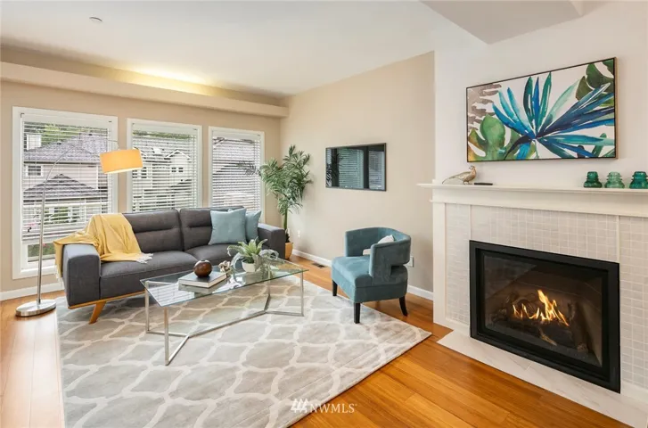 Your bright and cozy living room greets you and yours. Cozy up to the fire at the flip of a switch.