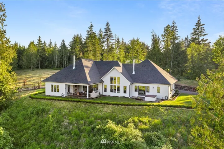 Sprawling custom home perched high on a hill overlooking Pleasant Valley, Mt. Rainier, Mt. Saint Helens, and Mt. Adams! Home was designed around the Mt. Rainer View. Mt. Saint Helens and Mt. Adams are visible from the yard.