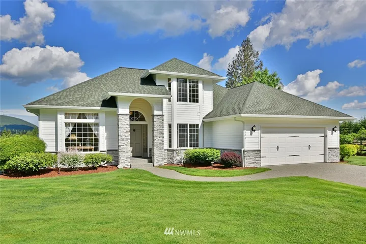 Set in the heart of a 20 acre equestrian farm this lovely custom 2 story home with guest suite/den sits prominently on the ridge looking both east and west and is abutting 25,000 acres of DNR & Forest lands teaming with wildlife, trails, lakes and ponds.