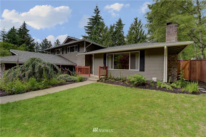 Another front view of the home with small front porch.