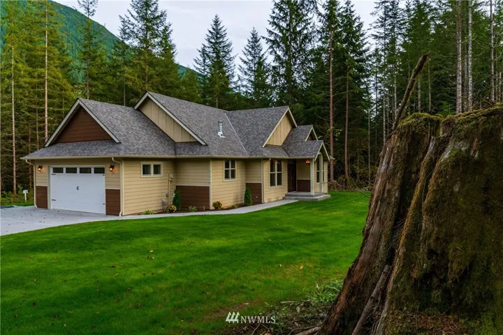 Lot 6 is complete! Move-in-ready, hydro-seed is down, finish trim is done, and all that's missing is YOU!  1000sf of stylishly woodsy single-level living, complete with covered outdoor entertainment space, a poured aggregate patio and wrap-around walkway, and a sweet front entry you're going to love!