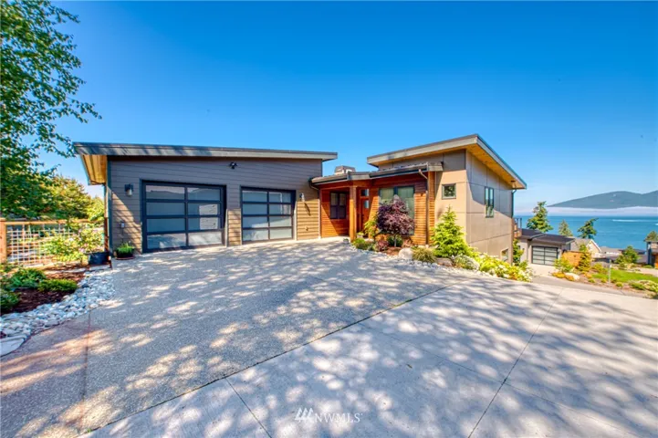 Prestigious Channel Landing Community is comprised of custom built NW contemporary homes with stunning views.