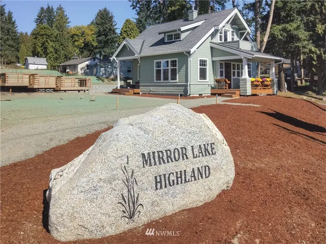 Mirror Lake Highland entrance monunent and the Franklin model on Lot #2 in background.
