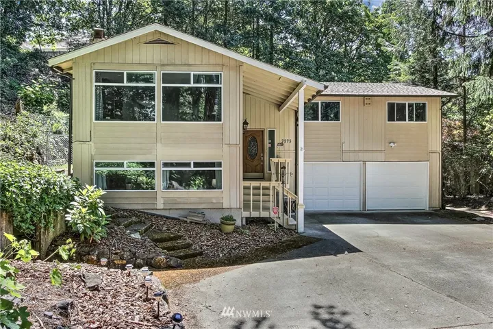 Beautiful 4 bedroom home nestled in the trees at the end of a long entry.  This lovely home sits on an large lot (almost half an acre) near Chambers Creek.