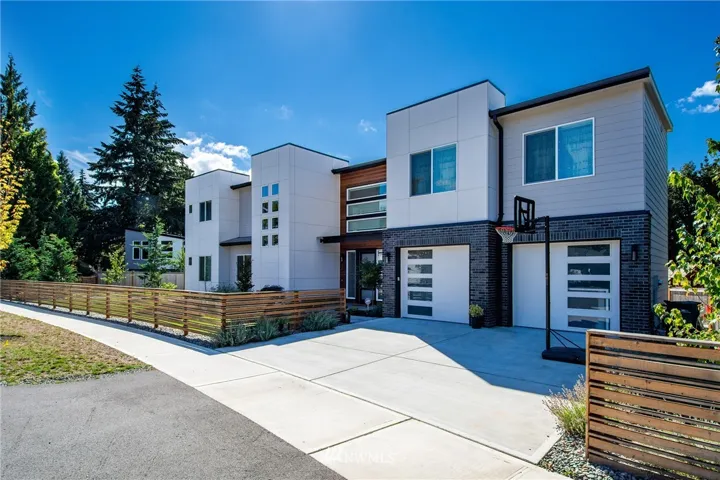 Single Family Contemporary Home sits on nearly fully fenced large lot (10,163 sf) with sunny backyard facing south (not shown in this pic).