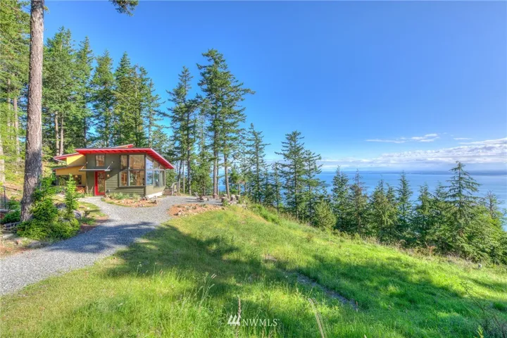 The Main House...sweeping marine views and night lights ... includes Mt Baker, the Cascades, various islands.  Superb view control and privacy on 9+ acres