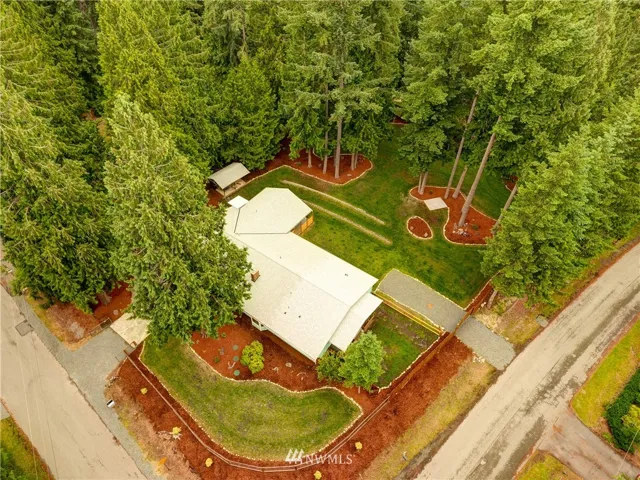 Almost an acre on 2 lots, beautifully wooded property.