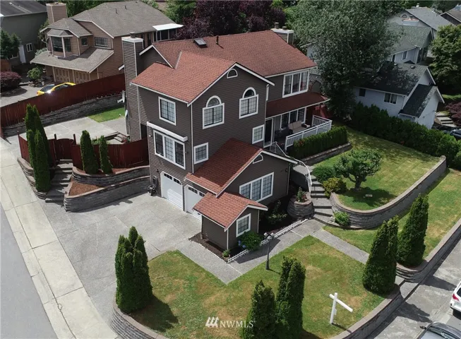 Beautiful House with Manicured landscaping and unique architecture style.