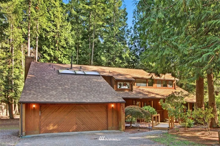 Custom Built Northwest Contemporary Home. Vast use of natural woods and stained glass.