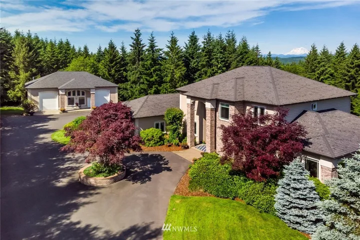 There's no place like HOME and no home like THIS PLACE!  This gorgeous estate boasts nearly 6.5 acres of pristine grounds with another 5 adjacent acres available for purchase if you need a little more room to roam.  "Well, hello Mt. Rainier"!