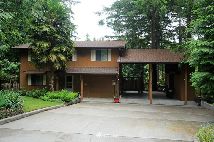 Cute lakefront home in Sunwood Lakes community.  Lot features mature landscaping, large concrete driveway, attached single car garage and story and a half carport with built in storage sheds.