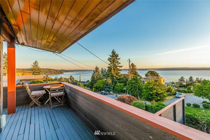 Gleaming refinished fascia cover this wrap-around deck. This is the South-facing view looking toward Seahurst Park and Three Tree Point. This desirable “Shorewood on the Sound” neighborhood even has private beach access to members of Shorewood On The Sound Community Club w/ membership $60-75/year. It’s not an HOA – just an optional membership for beach rights.