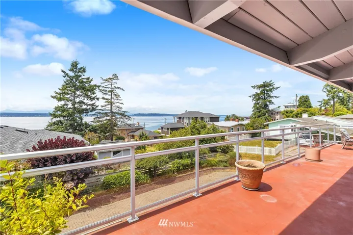 Glass railing wrapping around the balcony. Plenty of space to entertain.
