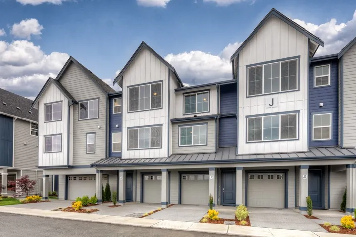 This home includes two masters separated by a loft space.  HUGE kitchen and open living space - lovely finish + AC!