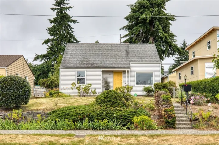 Well cared for home is set up off the quiet residential street with a covered porch entry.