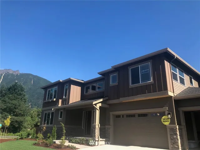 New Floor plan. 4 bdrm + bonus. 3 car garage & CORNER lot.  Amazing views of Mt. Si and Rattlesnake Ridge. 3110 sft and  HUGE bdrm on main.  Great multigenerational opportunity.