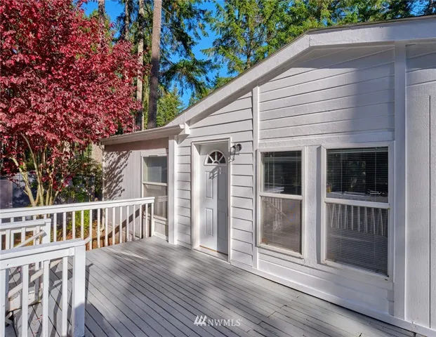 Brand new siding around door, new door frame and door, removal of the decorative fascia see photo 2, same work on the back door, new light fixtures installed. Additional work on the deck.
