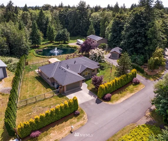 Amazing setting on the end of paved Lane with only a handful of beautiful acreage homes just 4 minutes from I-5 highway.
