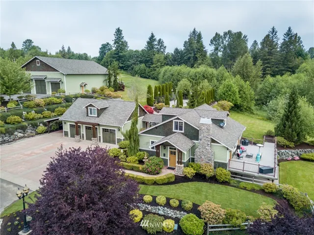 Luxury Meets Country Estate, Featuring Main House with 4 bedrooms, 2 bathrooms, 3 Car Garage with 1 bedroom, 1 bathroom apartment above, and Large 5 bay Shop, on 5 acres.