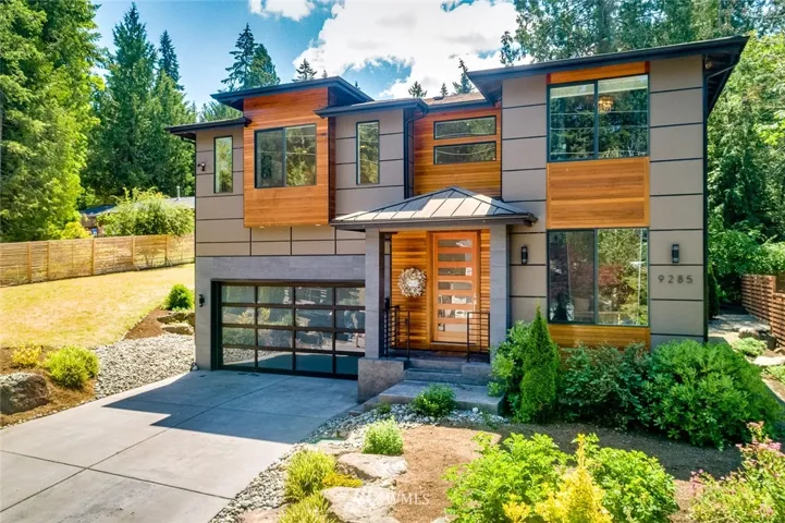 Elegant design on an open, sunny lot make this NW modern home shine