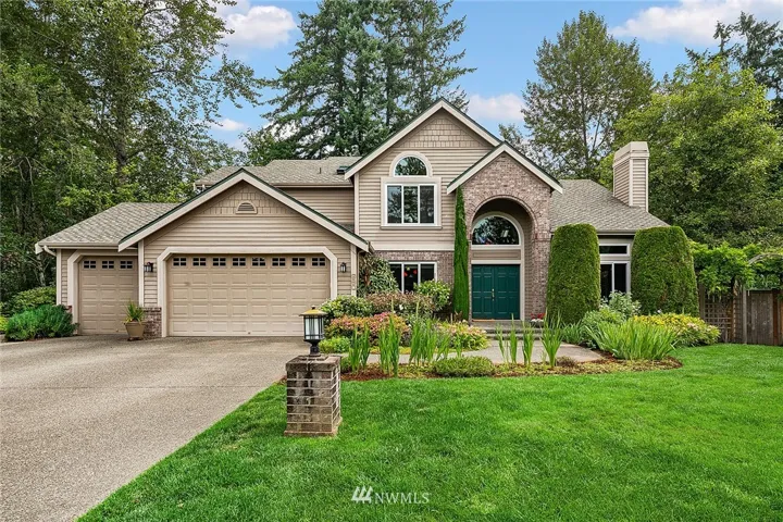 One of the loveliest homes in Morgans Ridge awaits you!  Flowering perennials border the walkway. This home is a gardener's dream come true!