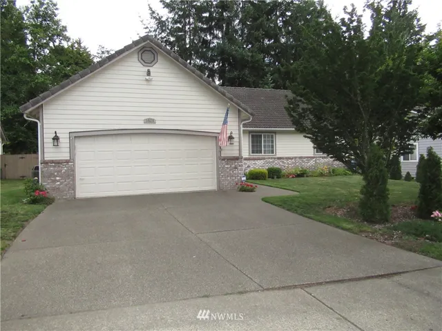 Welcome home!  Hardie-plank siding with brick accents...