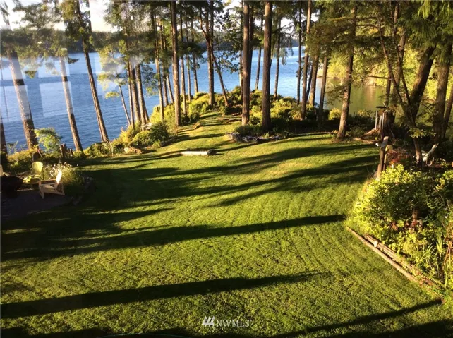 This is another view out the master bedroom window.  The day was sunny - the tide was in and the grass was just mowed.