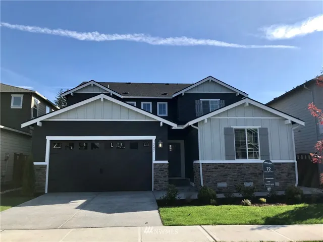 Stunning NW Craftsman home built by LENNAR NW, Inc. This is a photo of the actual home. Most interior photos are of another model home built by LENNAR with the same beautifully laid out open concept floor plan. Color selections and finishes may vary.*