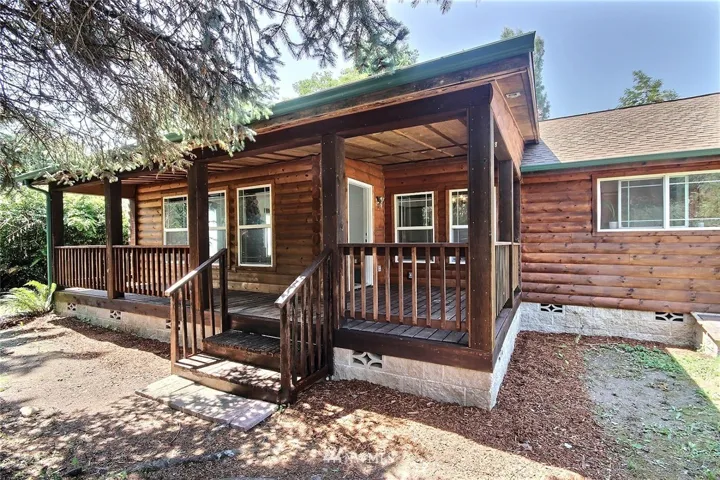 Country style front porch, imagine sitting here reading a good book or sipping your morning coffee, perhaps evening wine??