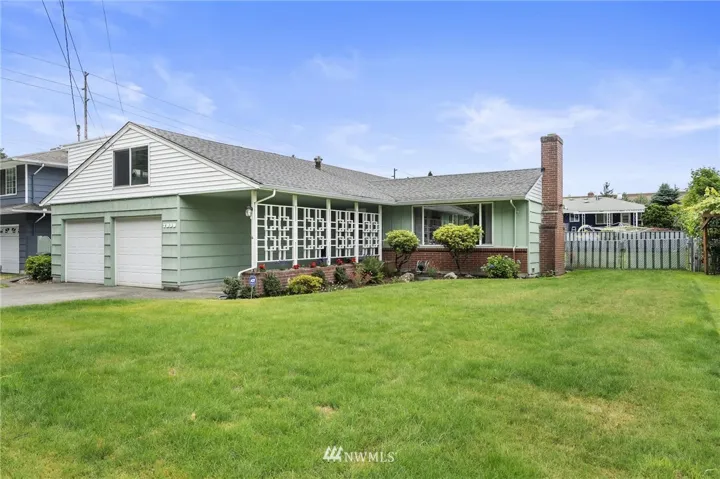 Welcome home to single level living close to everything! Check out the sweet retro detailing, planter box, and wide walkway.
