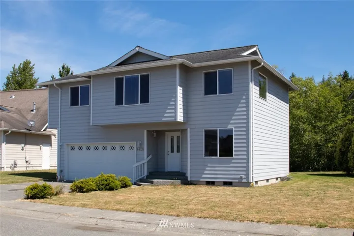 This home is situated on a large, flat parcel that abuts a greenbelt in a quiet neighborhood just minutes to the Birch Bay's waterfront.