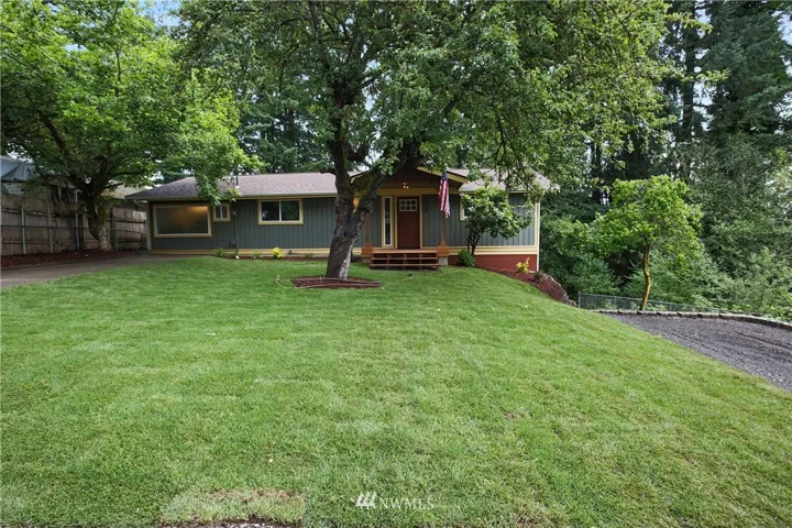 Front view - New landscape with new sod lawn, 2 parking areas - room for boat or RV