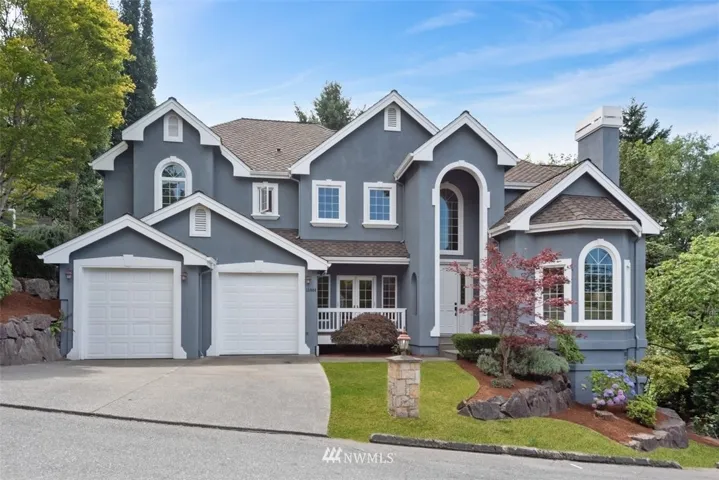 Outstanding NW Traditional 2 story home in Holmes Point, Kirkland. Located on a quiet street in Eagle Ridge with access to 600 acres of parks, community boat launch & OO Denny waterfront park and no HOA.  Quality construction with large rooms, vaulted ceilings, balcony overlooks, soaring ceilings on 1st floor, 9' ceilings throughout 2nd floor with large rooms perfect for entertaining large gatherings.