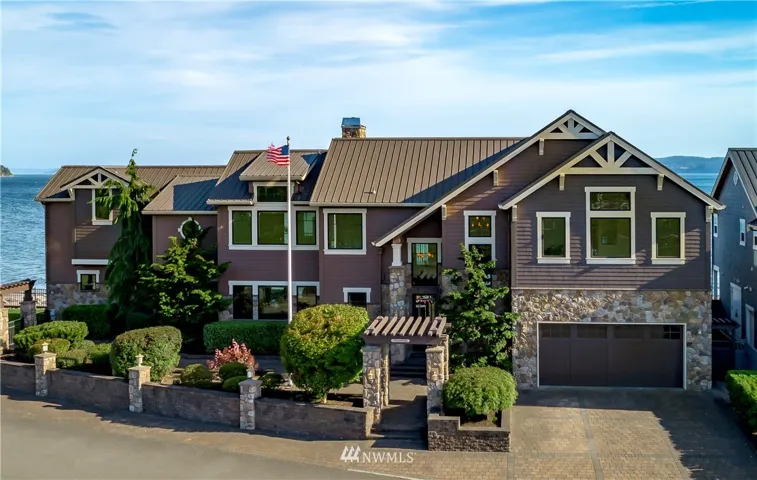 Captivating package consisting of a Whistler style lodge with Craftsman finishes nestled on an extraordinary property with 203 ft of waterfront.