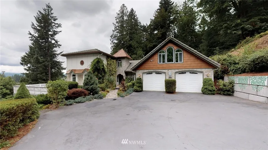 One of a kind custom built home on very private lot overlooking Dyes Inlet and the Olympic Mountains from most every room!  Large entertainment decks allow for flexibility of lifestyle and year round entertaining.