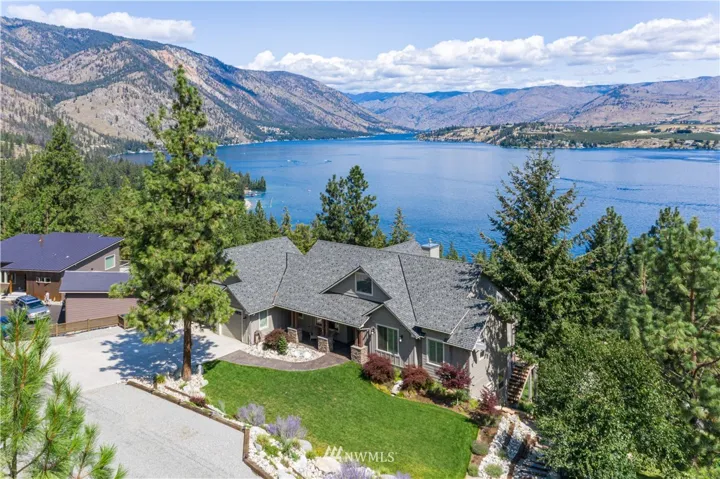 Welcome home to 7470 Navarre Dr, above Lake Chelan State Park and boat launch. Enjoy big Lake Chelan views across to Manson, Wapato Point and up lake.