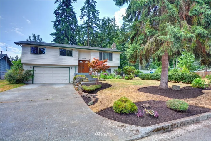 Four bedrooms + an extra finished room with a family room and a bonus room. Roof is approx. 2 years old, heat pump for efficiency & air conditioning. Detached shop for RV & extra cars or woodworking. Over 1/3 of an acre lot. Newer roof, vinyl windows, all real wood siding, 1 fireplace and 1 pellet stove. All rooms are large, over 2800 sq ft....not your typical split level home.