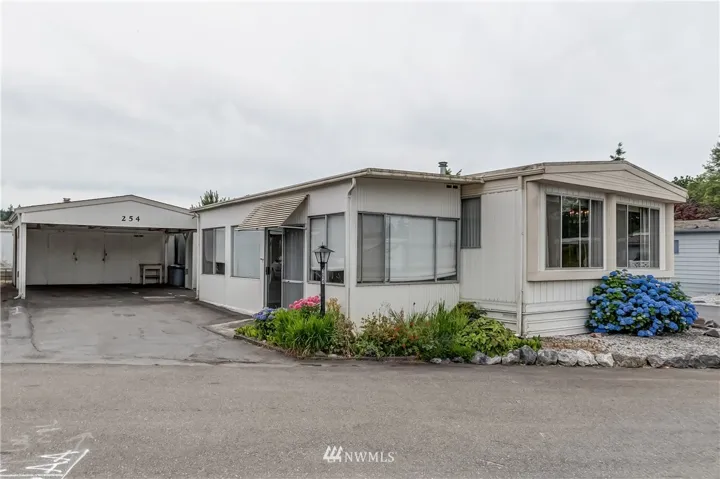 Welcome to unit #254 in Lakeway mobile estates. This double wide mobile home has a large corner lot with plenty of extra parking and a low maintenance yard.