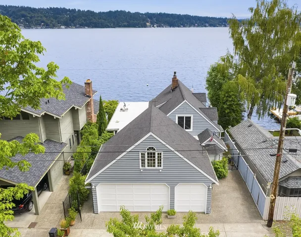 Beautiful waterfront home with gated entry, a 3 car garage and additional parking