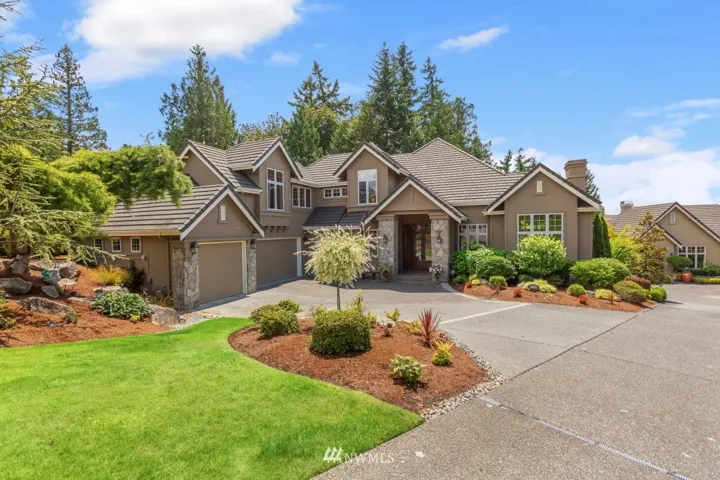 On a private drive with plenty of parking spaces. New exterior paint and a lifetime roof. Beautifully landscaped with timed outdoor lighting and security cameras.