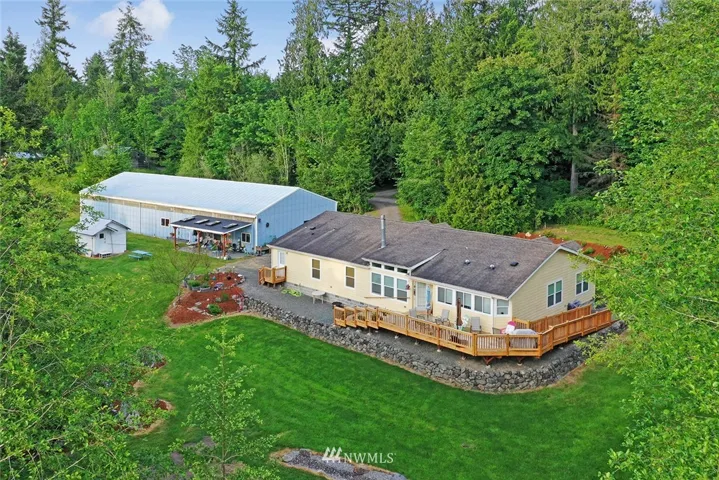 Large home, huge shop, 1-bd apt and over 15 acres to roam!