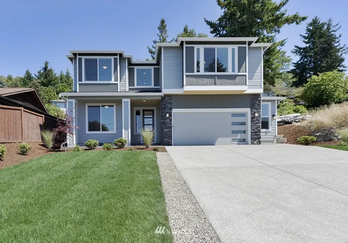 The Staccato! In highly sought after Browns Point, this 4 BR home offers views of Puget Sound.